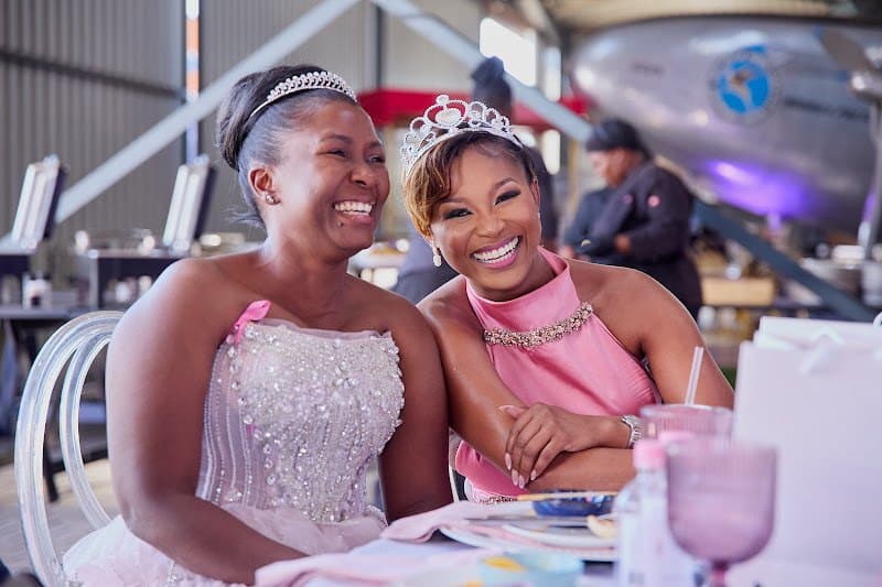 Two community guests smile together at a foundation gathering
