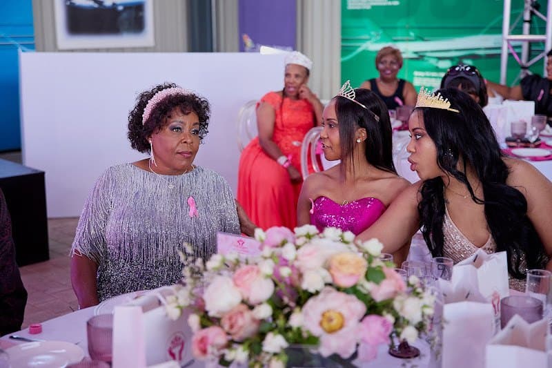 Guests share a table at a Princess Nakedi Foundation gathering.